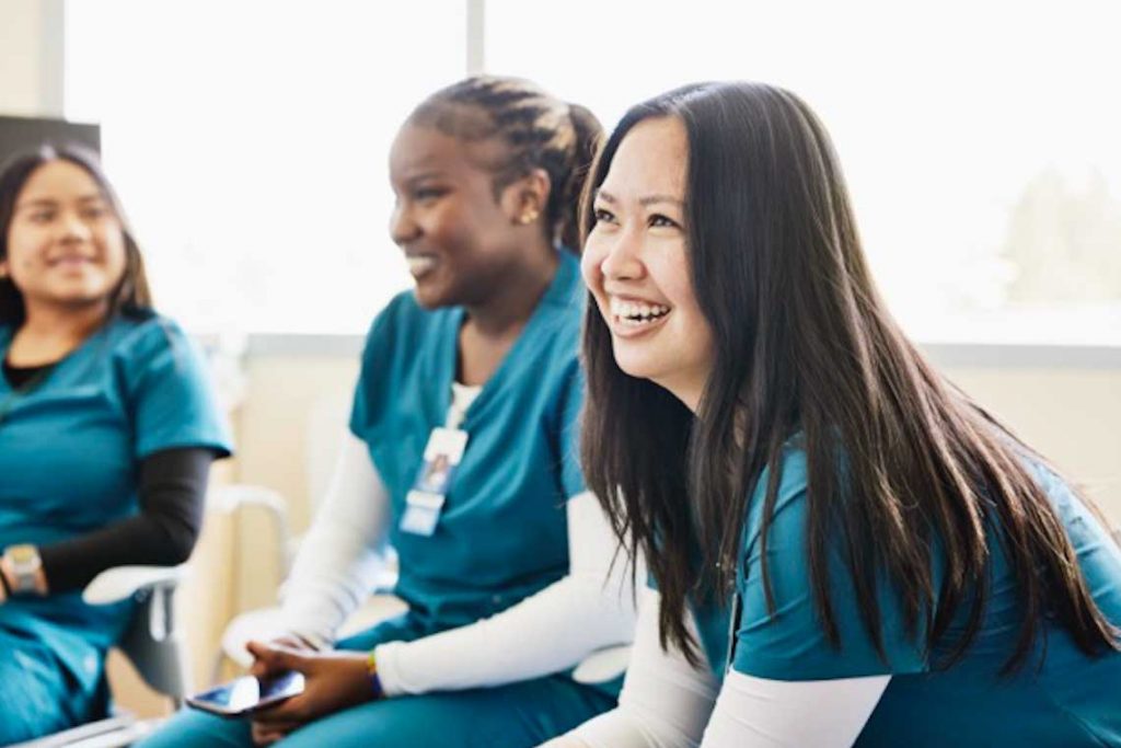 nursing students talking and smiling