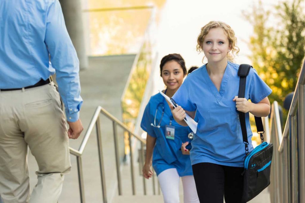 nursing students walking up stairs
