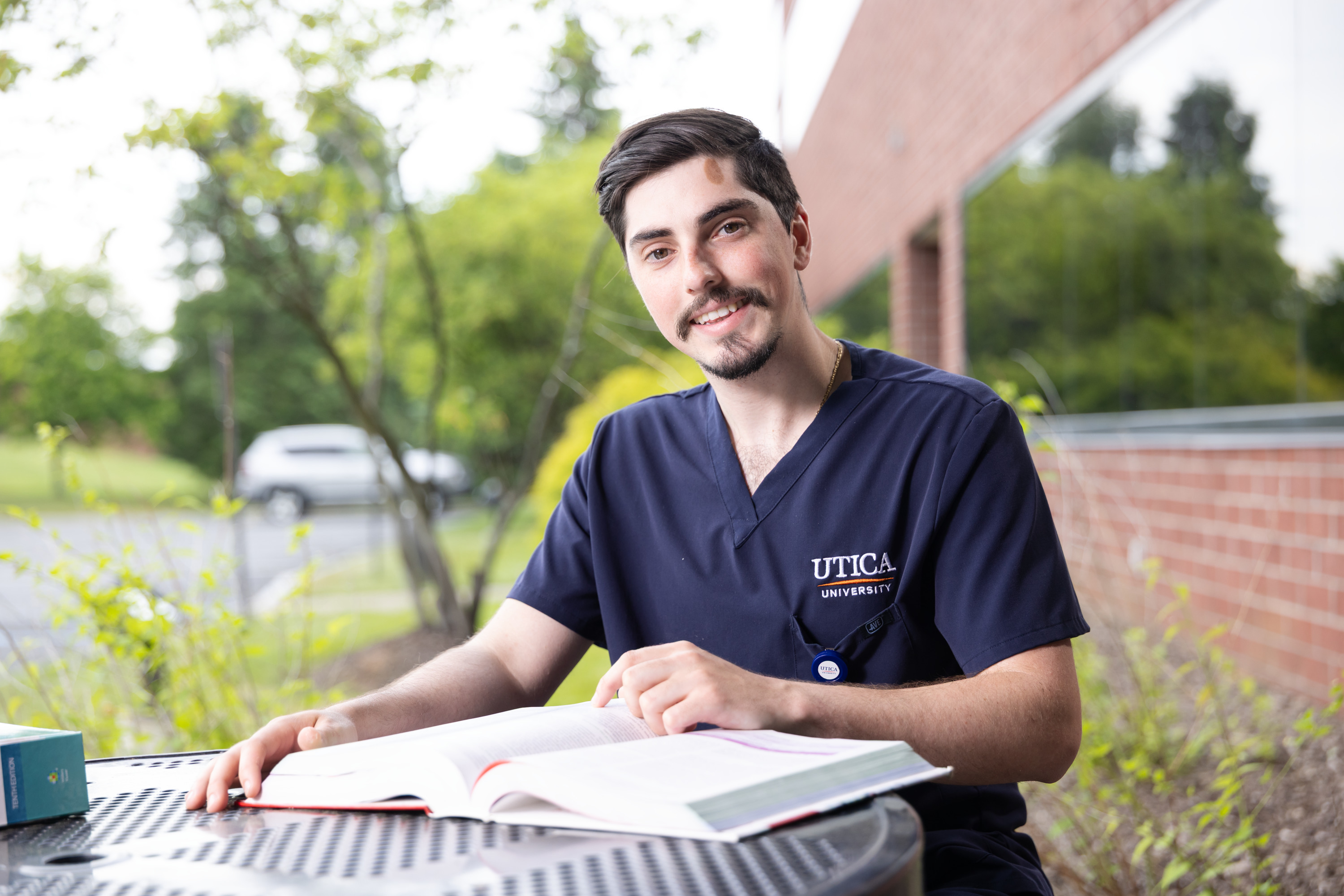 Nursing student studying outside