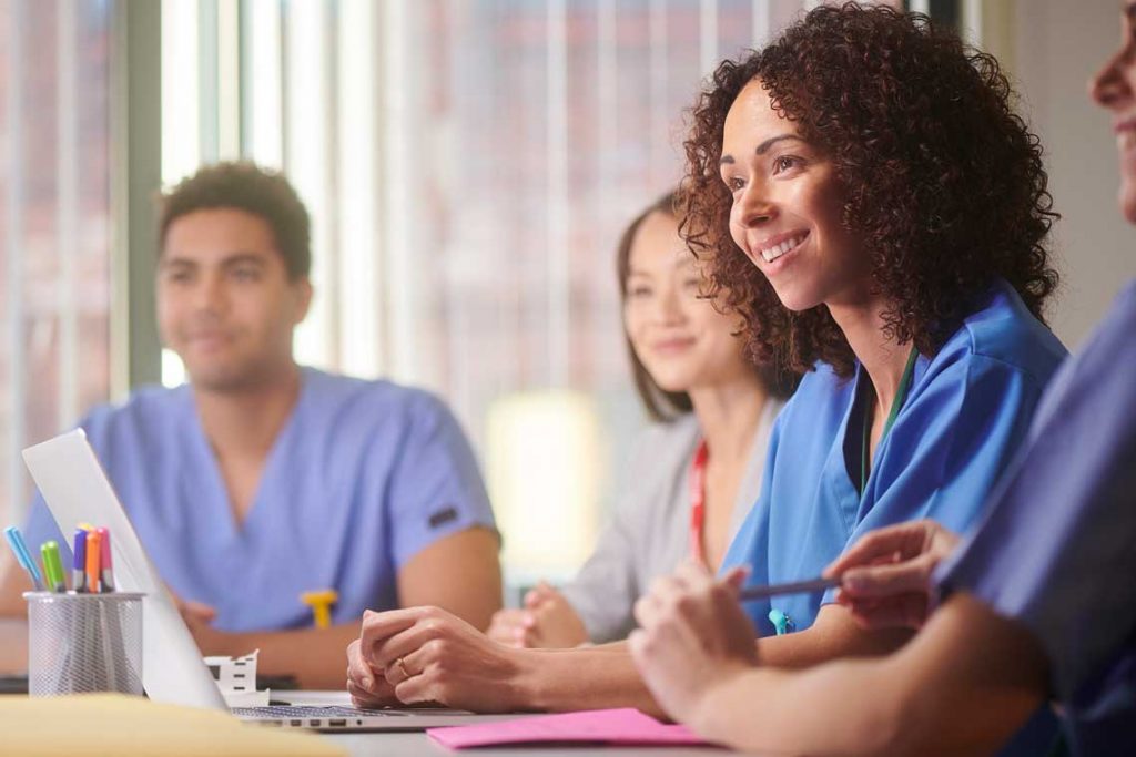 nurses sitting at a table