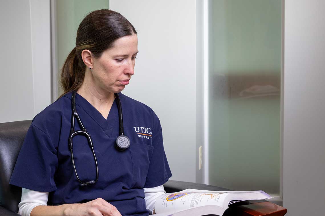 ABSN student reading textbook