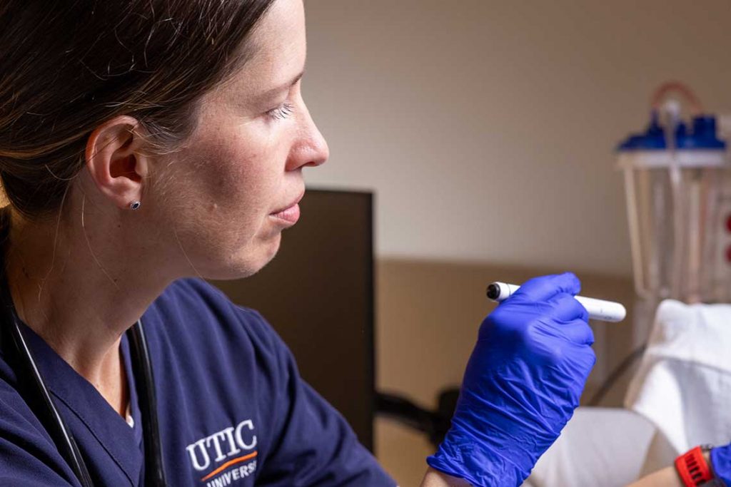 close up of nursing student practicing lab skills