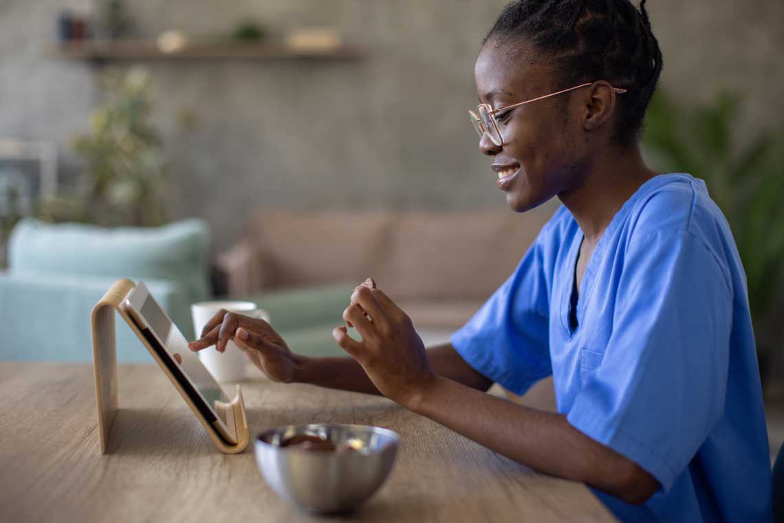 nurse working on tablet