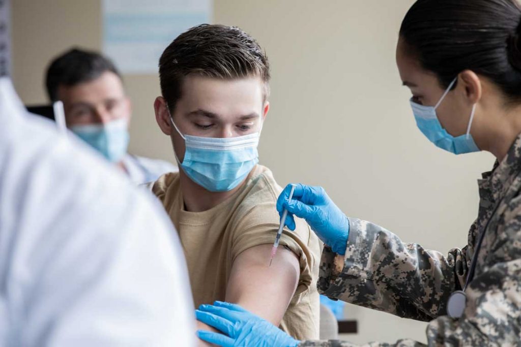 nurse giving patient a shot
