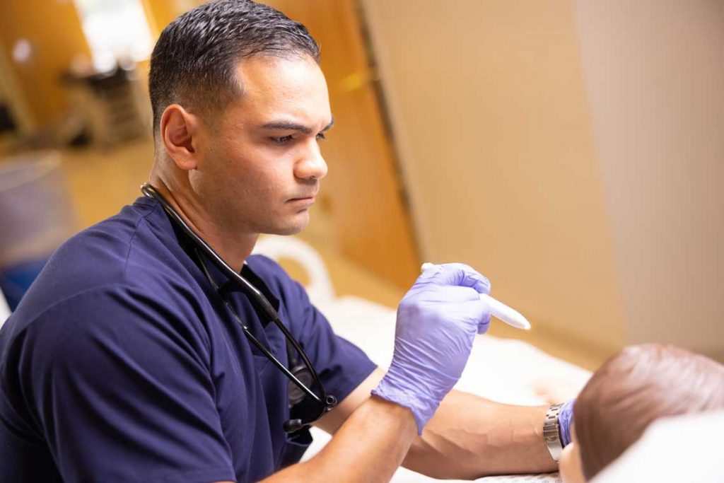 Utica nursing student in sim lab