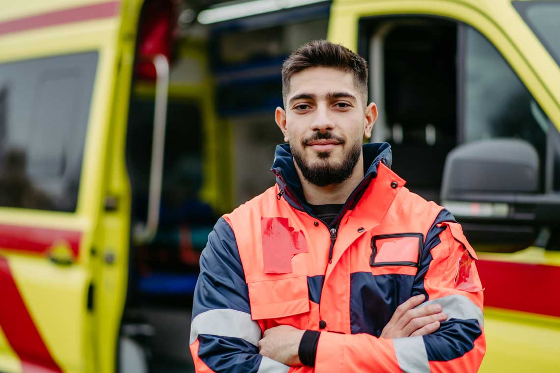 EMT standing outside by truck