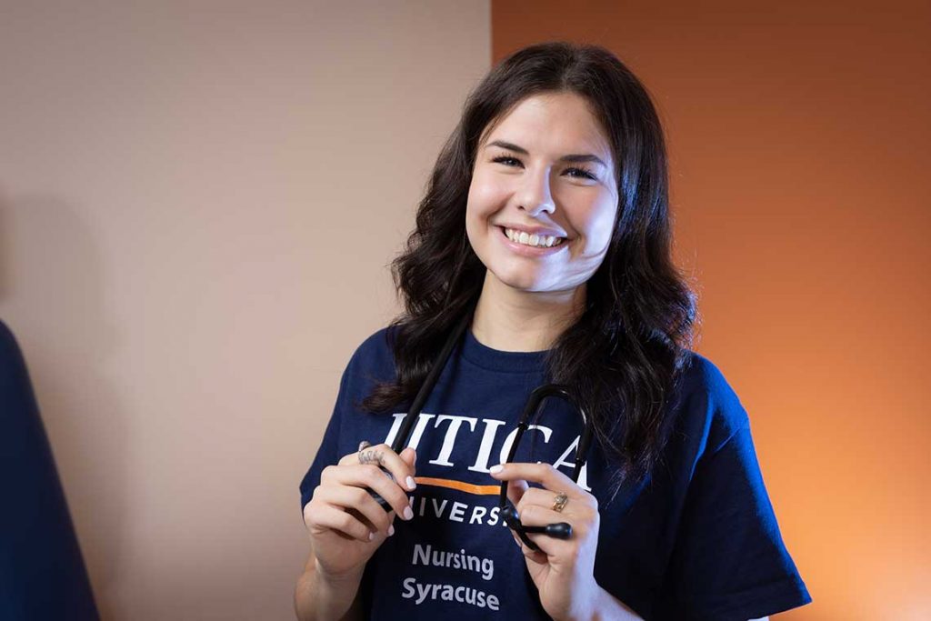 Utica ABSN student holding stethoscope